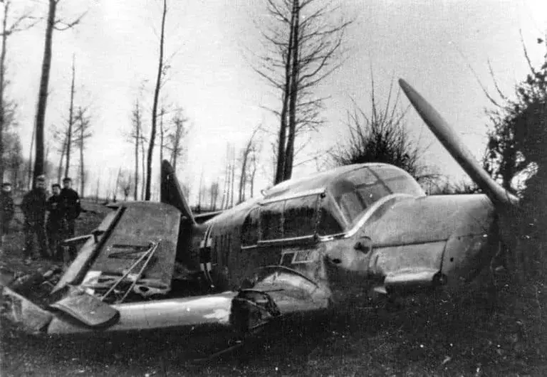 The wreck of the Messerschmitt Bf 108 Taifun, which was carrying Major Helmuth Reinberger and the plans for Operation Fall Gelb, in a field near Vuchts.